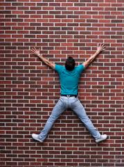 Man and woman holding hands on a beach. They are in their honeymoon phase